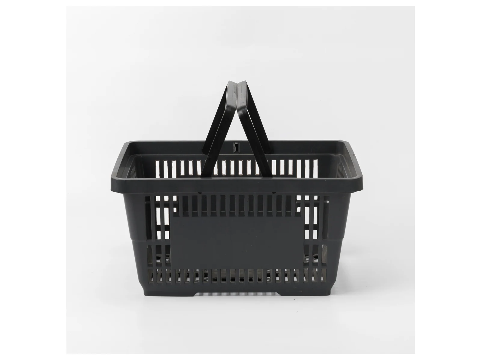 Black Hand Basket with Twin Handles photographed from the front on a white studio background