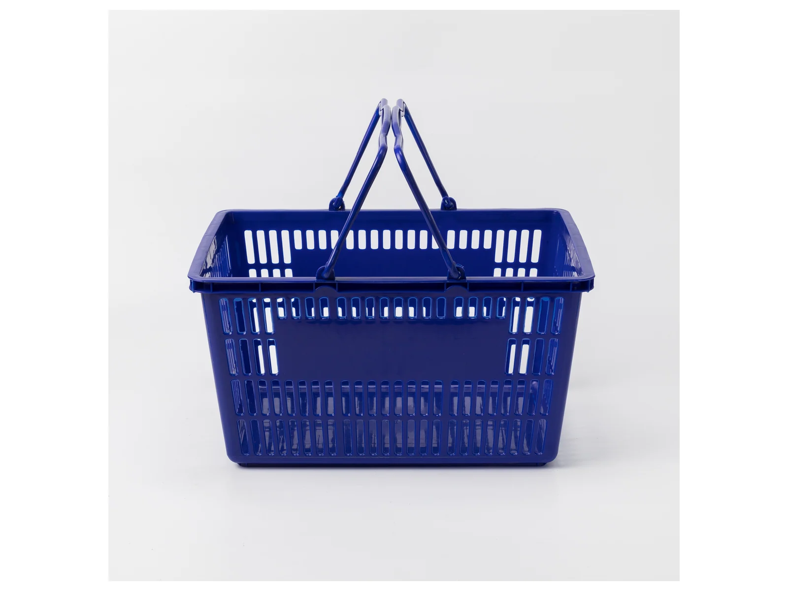 Blue Hand Basket with Twin Handles photographed from the front on a white studio background
