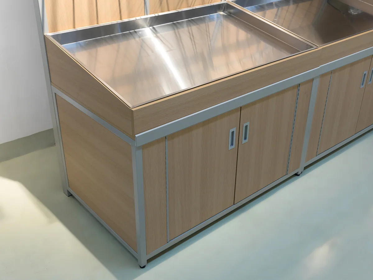 Close-up of the angled wire shelf arms projecting from the back panel