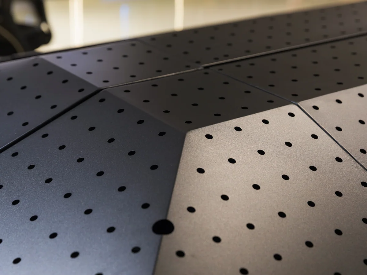 Close-up of the black steel frame around the island panels