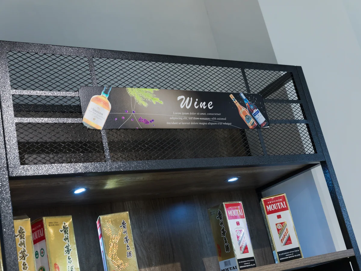 Close-up of the black steel frame of the wine wall
