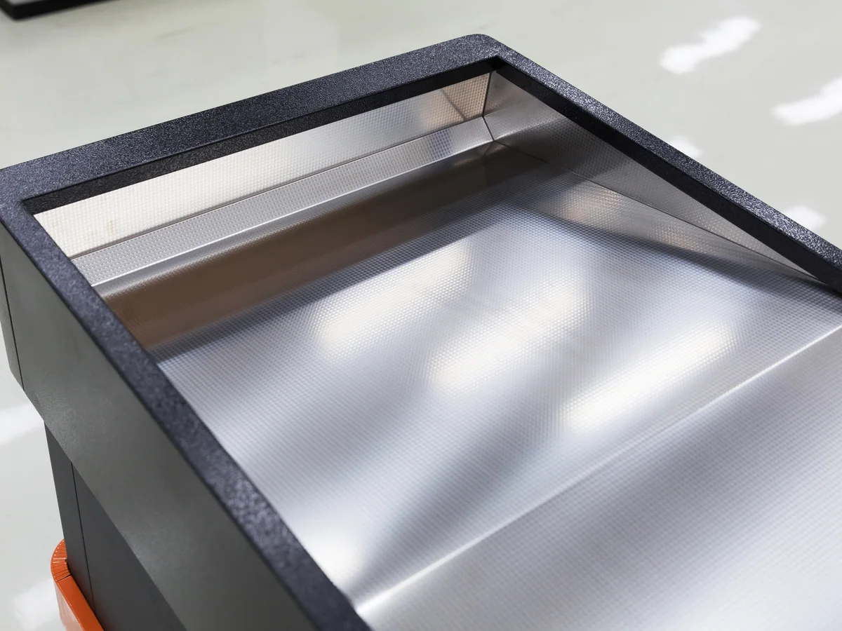Close-up of the charcoal powder coated front panel above and below the band