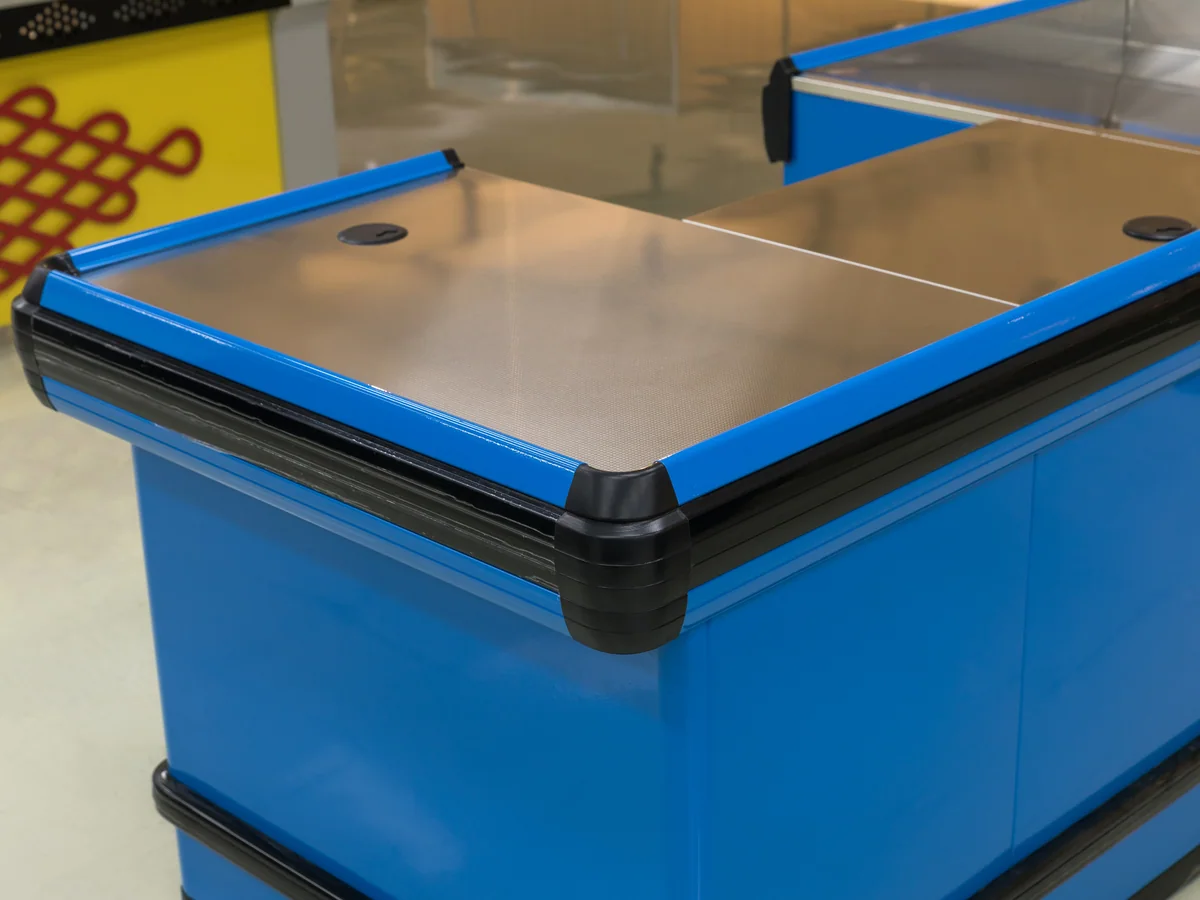 Close-up of the dark trim along the top edge of the blue counter