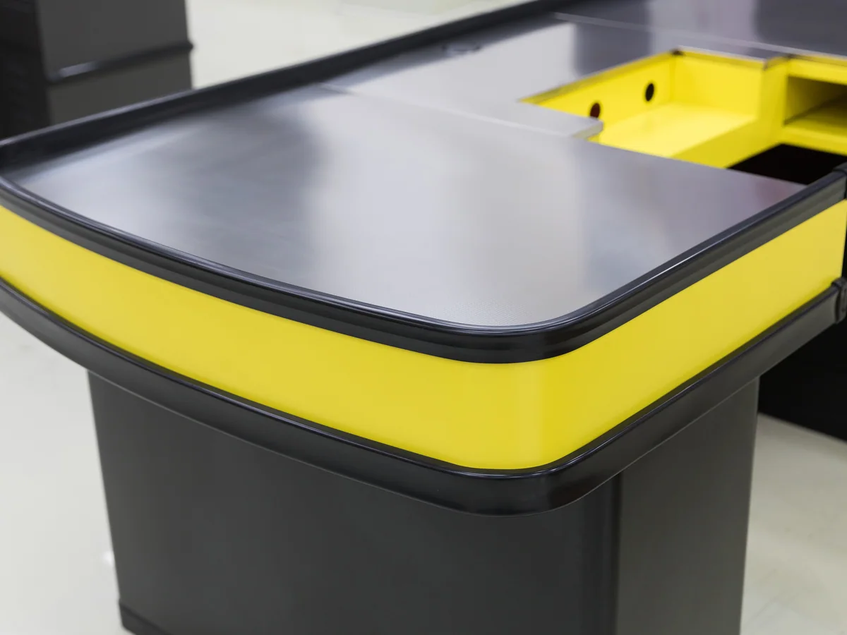 Close-up of the darker plinth running along the base of the counter