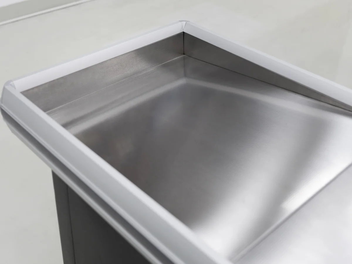 Close-up of the deep pressed stainless well at the till position