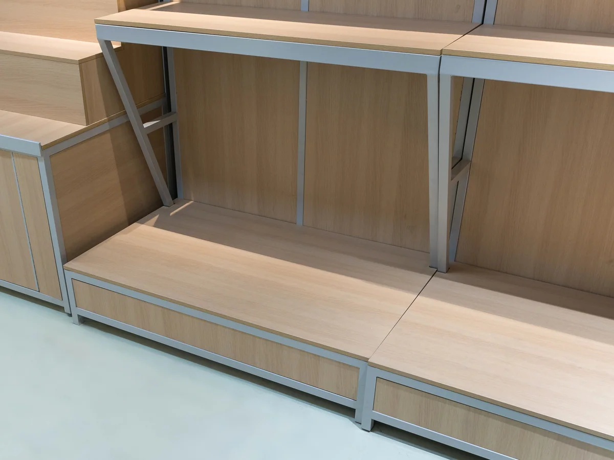 Close-up of the open base under the wall shelving