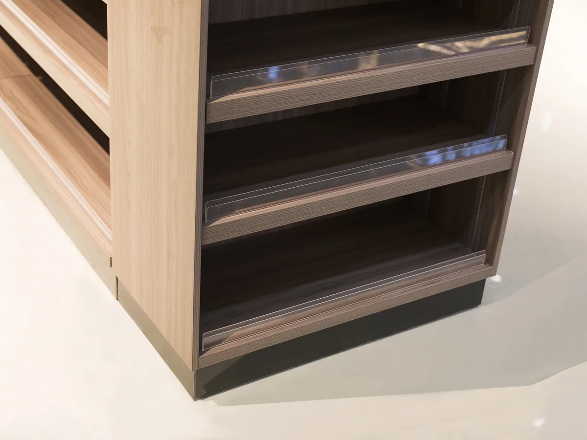 Close-up of a pale timber shelf in the bay