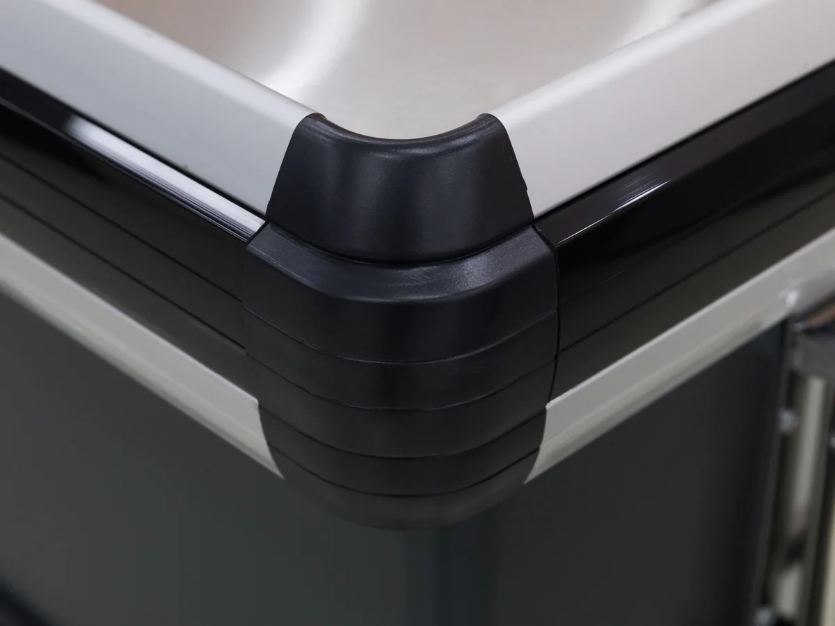 Close-up of one of the two pressed stainless tops on the counter