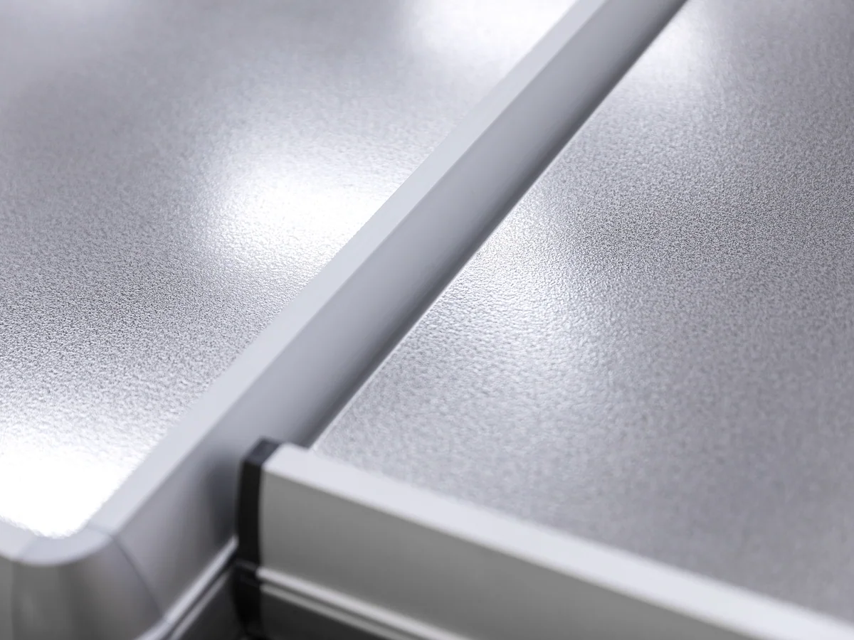 Close-up of the pressed stainless worktop showing the rolled edge