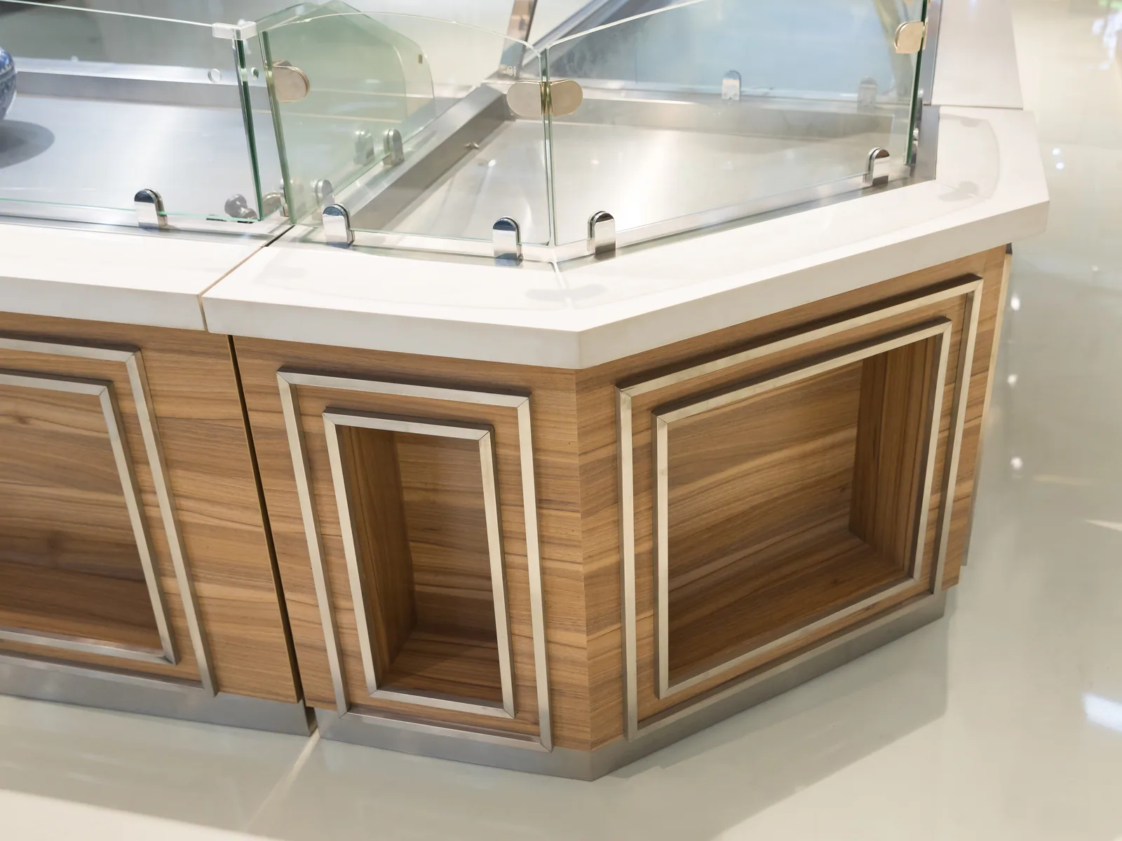 Close-up of a timber service counter and worktop edge in the Keshun showroom