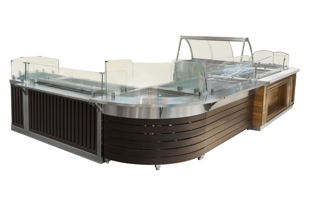 Cranked supermarket deli counter in dark timber with a stainless service well and curved glass sneeze screens