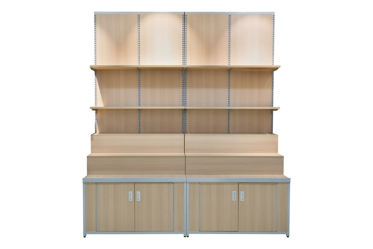 Light timber supermarket wall shelving unit for grain with a closed base cabinet below