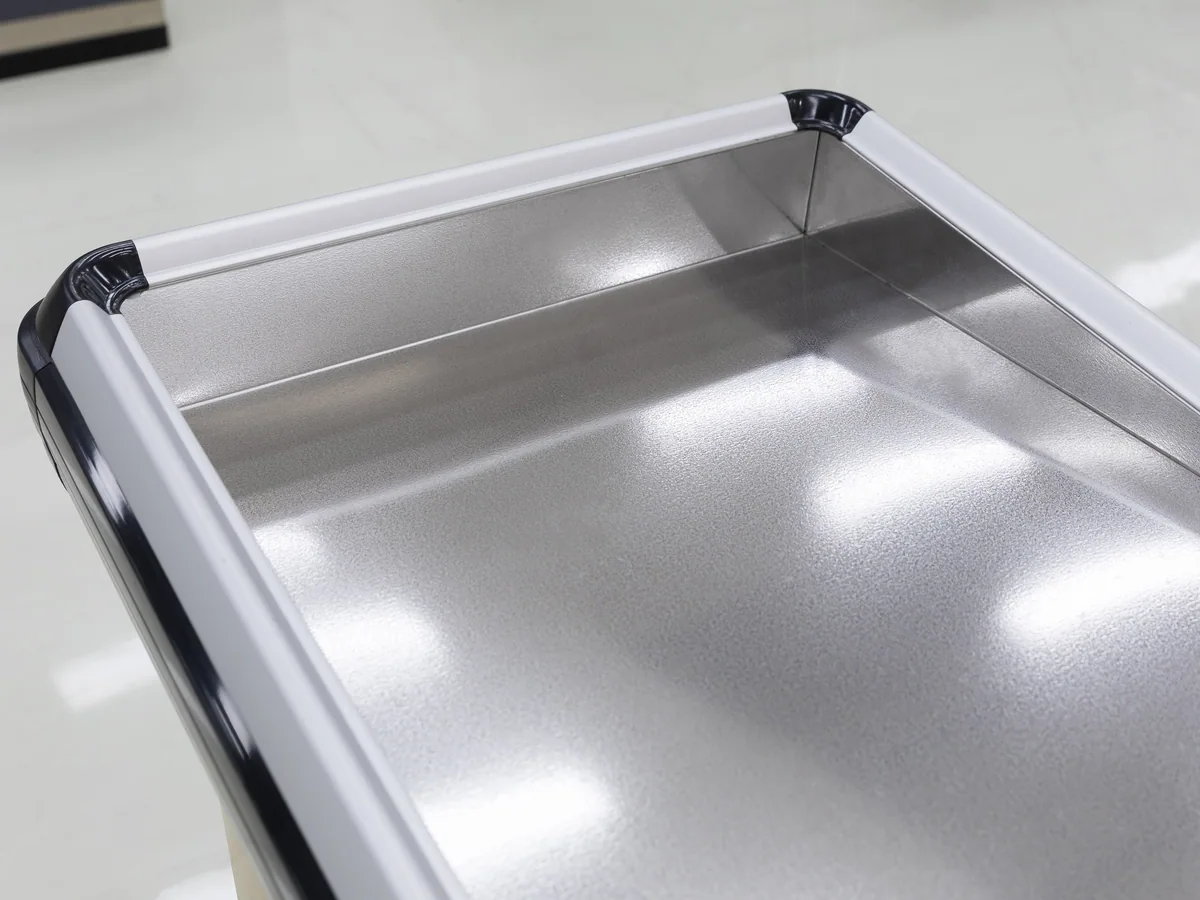 Mirror polished stainless steel top on a Keshun supermarket cashier counter