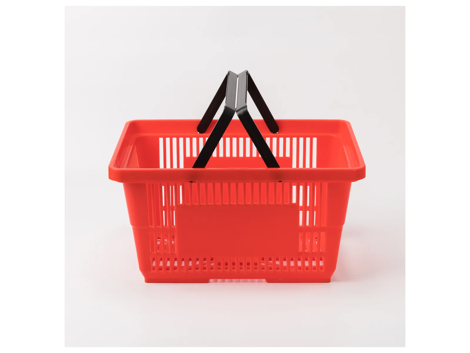 Red Hand Basket with Twin Handles photographed from the front on a white studio background
