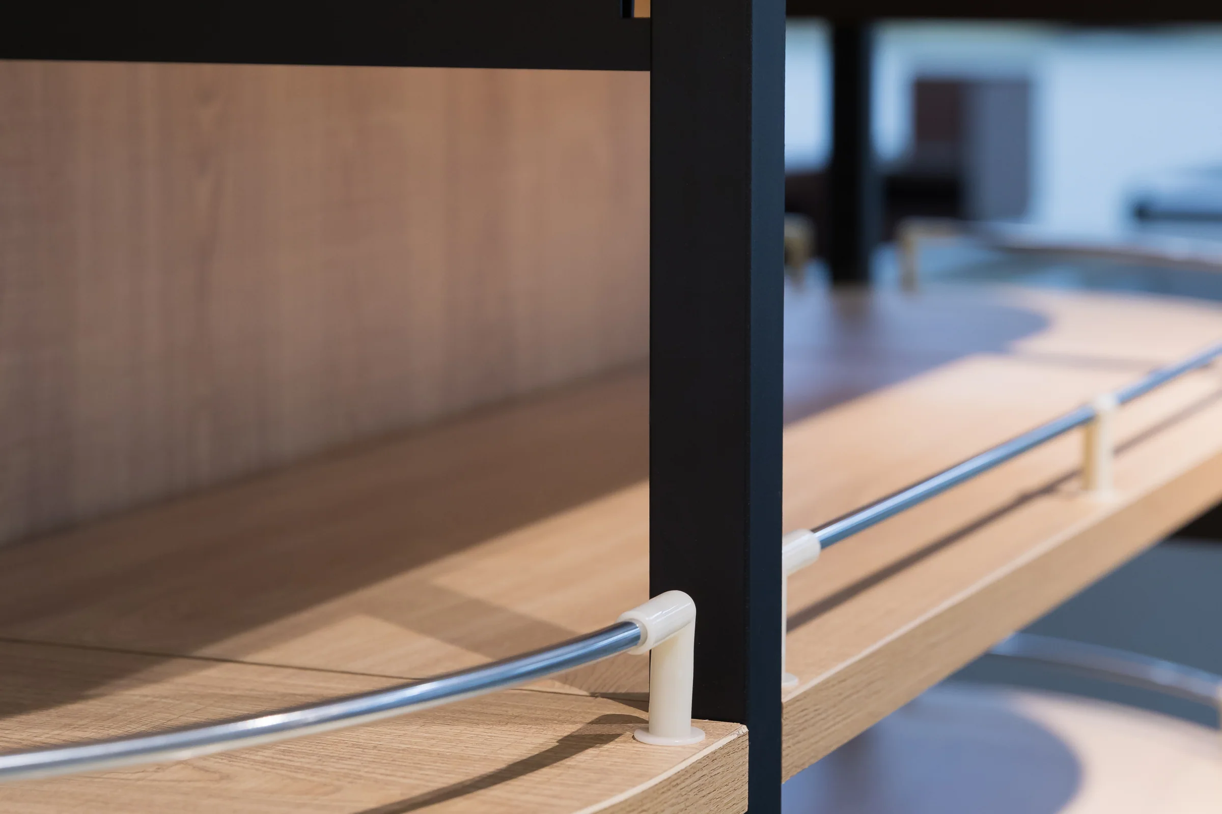 Keshun round end cap shelving tower with timber shelves radiating around a black steel core