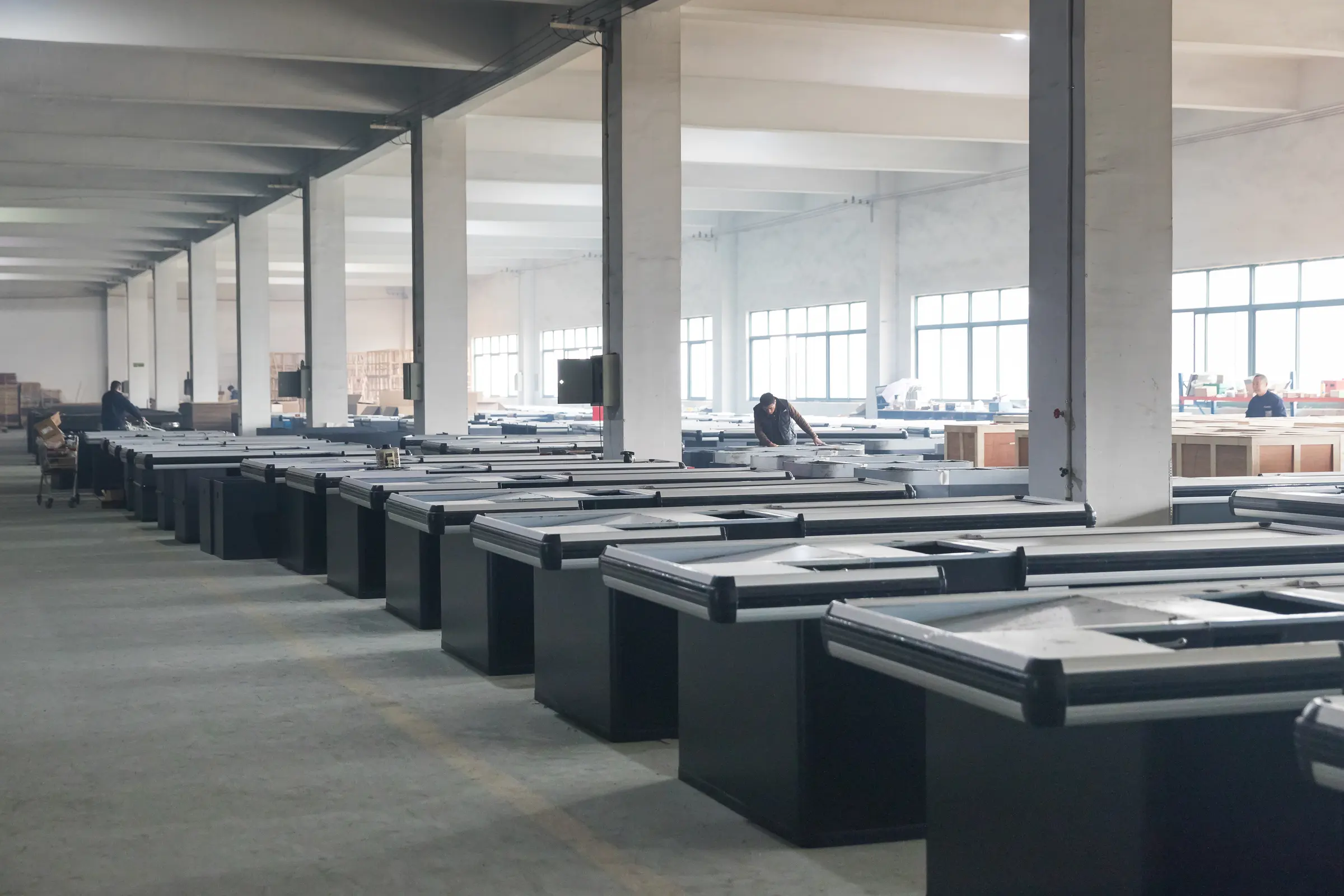 Rows of finished refrigerated cabinets staged inside the Keshun supermarket equipment factory in Changshu