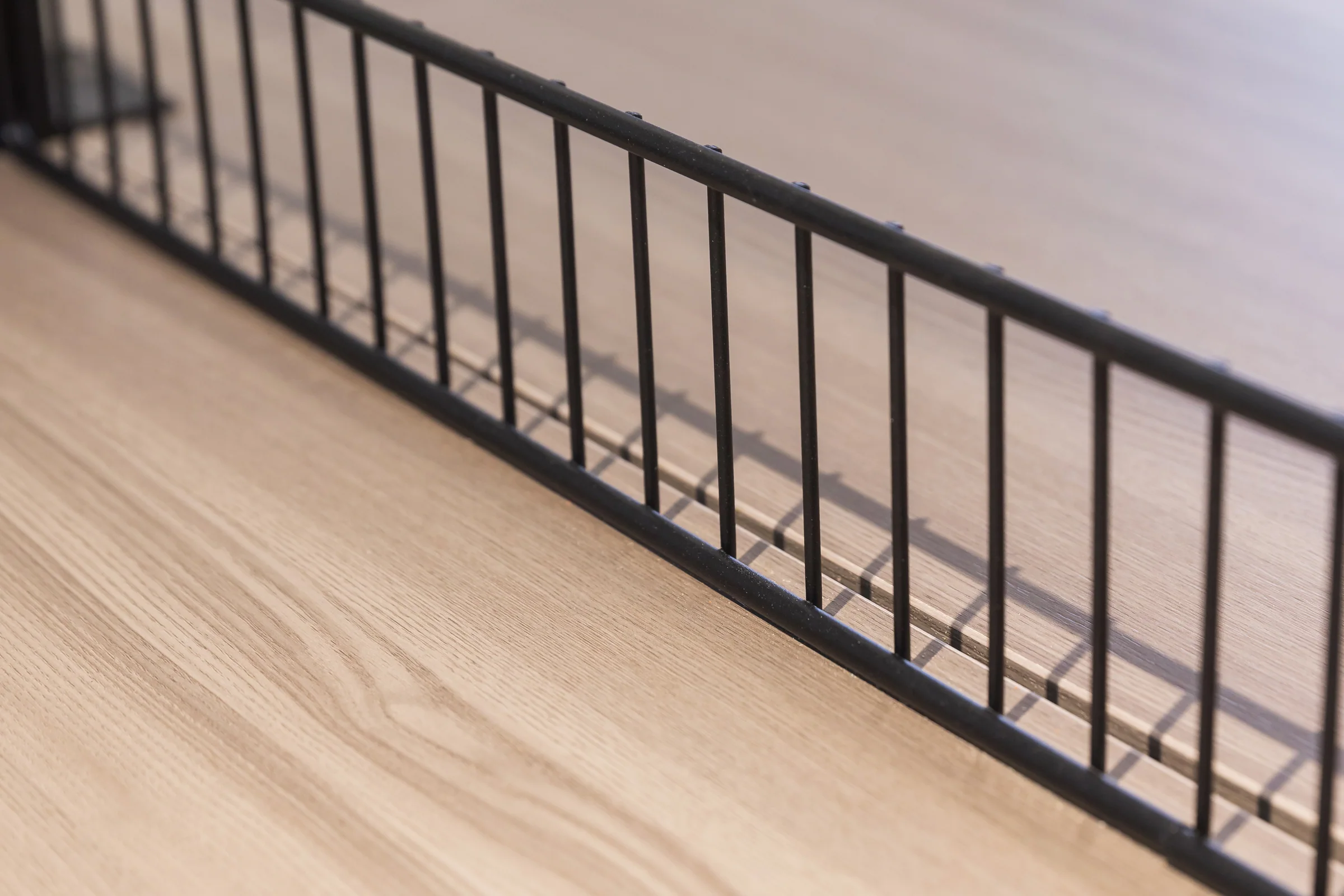 Keshun square two tier promotional table in a black steel frame with a wire guard rail