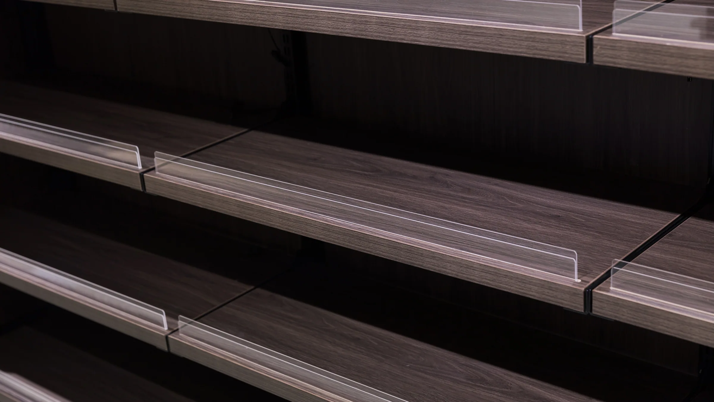 Steel and wood shelving bays and heavier storage racking standing together in the Keshun plant