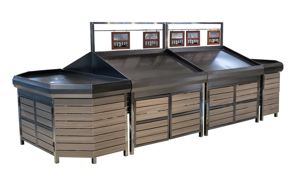 Supermarket fruit and vegetable rack island with tilted trays and a timber clad base run