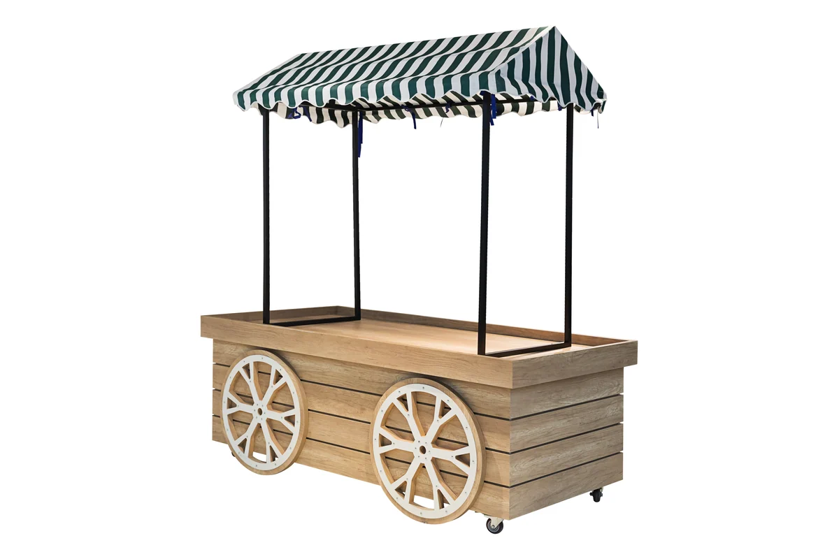 Timber market cart with cartwheels and a striped canopy used for selling prepared food in a store