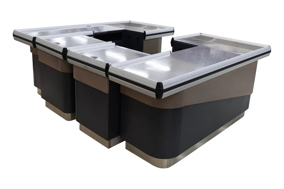 Twin position supermarket cashier counter with two working stations joined into one run of stainless tops