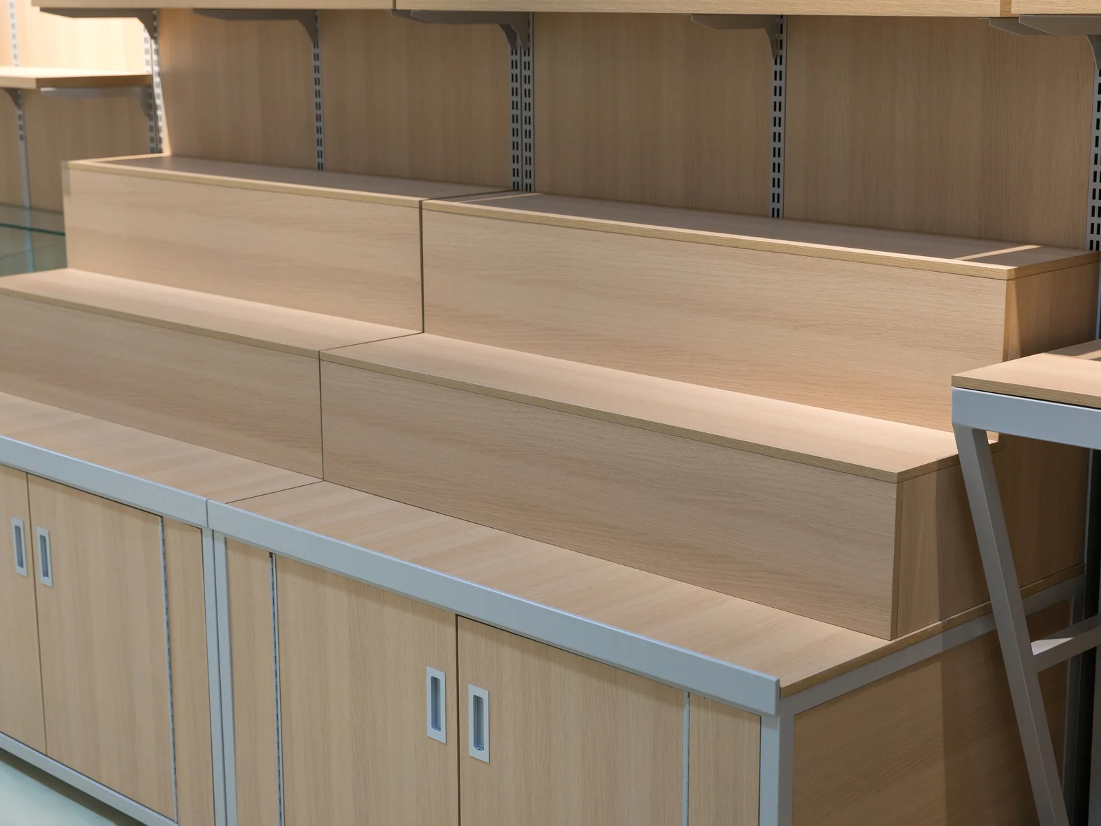 Wall grain shelving photographed straight on showing the closed base cabinets